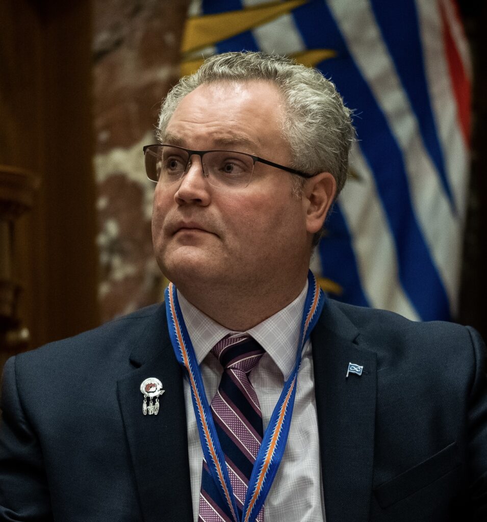 John Bieker - the PABC  Board President in front of British Columbia flag